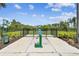 Dog park featuring a water fountain, pet waste station, and an enclosed fenced area for dogs to exercise and play at 4918 Gray Owl Ter, Palmetto, FL 34221
