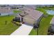 Single-story home featuring a well-manicured lawn, mature landscaping, and a private driveway at 4918 Gray Owl Ter, Palmetto, FL 34221