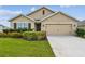 Charming single-Gathering home with a well-manicured lawn and beautiful landscaping at 4918 Gray Owl Ter, Palmetto, FL 34221