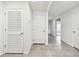 Hallway with tiled floor provides access to different areas at 4918 Gray Owl Ter, Palmetto, FL 34221