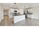 Bright kitchen with stainless steel appliances, granite countertops, and tile flooring at 4918 Gray Owl Ter, Palmetto, FL 34221