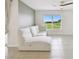 Bright living room features a plush sofa and large window at 4918 Gray Owl Ter, Palmetto, FL 34221