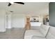 Open-concept living room seamlessly connects to the kitchen with modern appliances at 4918 Gray Owl Ter, Palmetto, FL 34221