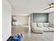 Bright living room featuring tile flooring and a comfortable, modern sectional sofa at 4918 Gray Owl Ter, Palmetto, FL 34221