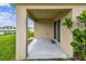 Covered patio with stucco columns, sliding glass doors and view of backyard and pond at 4918 Gray Owl Ter, Palmetto, FL 34221