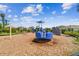 Community playground featuring a variety of play structures, surrounded by lush greenery and well-maintained landscaping at 4918 Gray Owl Ter, Palmetto, FL 34221