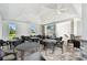 Bright, open recreation area features tables, chairs, and inviting atmosphere for socializing at 4918 Gray Owl Ter, Palmetto, FL 34221