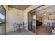 Screened-in balcony with a view of the inviting swimming pool and a glimpse of the cozy living space at 503 Albee Farm Rd # B6, Venice, FL 34285