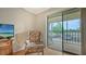 Bright living room with balcony access, creating an airy and inviting space for relaxation and leisure at 503 Albee Farm Rd # B6, Venice, FL 34285