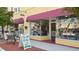 Commercial building with two retail businesses, large storefront windows, signage, and sidewalks at 503 Albee Farm Rd # B6, Venice, FL 34285