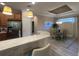 Charming dining area with stylish pendant lighting, modern countertops, and stainless steel appliances at 5031 Serata Dr, Bradenton, FL 34211