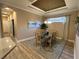 Elegant dining room with a chandelier, serene artwork, and natural light creating an ideal space for meals at 5031 Serata Dr, Bradenton, FL 34211