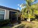 Outdoor screened in patio with palm trees offering shade and privacy at 5031 Serata Dr, Bradenton, FL 34211