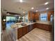 Spacious kitchen features breakfast bar and an open view to the living room and backyard at 5031 Serata Dr, Bradenton, FL 34211