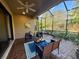 Cozy screened lanai with stylish furniture, perfect for relaxing and entertaining at 5031 Serata Dr, Bradenton, FL 34211