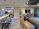Open-concept living area with bar seating and lots of natural light at 5031 Serata Dr, Bradenton, FL 34211