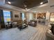 Open-concept living room flows into a modern kitchen, creating a bright and inviting space for Gathering and guests at 5031 Serata Dr, Bradenton, FL 34211