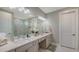Elegant bathroom with double vanity, spacious mirror and tiled walk-in shower at 5209 Barnett Cir, Lakewood Ranch, FL 34211