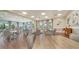 Well lit dining area with multiple tables, chairs, and large windows at 5209 Barnett Cir, Lakewood Ranch, FL 34211