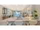 Spacious kitchen with island and stainless steel appliances, overlooking a serene water view at 5209 Barnett Cir, Lakewood Ranch, FL 34211