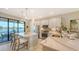 Modern kitchen featuring white cabinets, stainless steel appliances, and stylish pendant lighting over the island at 5209 Barnett Cir, Lakewood Ranch, FL 34211