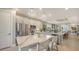 Modern kitchen featuring quartz countertops, stainless steel appliances, and a breakfast bar at 5209 Barnett Cir, Lakewood Ranch, FL 34211