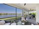 Inviting screened lanai with comfortable seating and stunning lake views for relaxing outdoor living at 5209 Barnett Cir, Lakewood Ranch, FL 34211