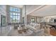 Bright and airy lobby with comfortable seating, floor-to-ceiling windows, and access to the pool area at 5209 Barnett Cir, Lakewood Ranch, FL 34211