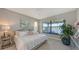 Serene bedroom with waterfront views, calming decor, and ample natural light at 5209 Barnett Cir, Lakewood Ranch, FL 34211