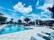 Stunning pool with lounge chairs and tables perfect for relaxation on a sunny day at 5209 Barnett Cir, Lakewood Ranch, FL 34211