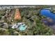 Beautiful aerial shot highlighting community pool, lush landscaping and neighboring waterway at 5548 Simonton St, Bradenton, FL 34203