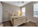 Bright bedroom featuring wood floors, a ceiling fan, and a neutral color scheme at 5548 Simonton St, Bradenton, FL 34203