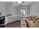 This home office offers wood floors, a ceiling fan, built-in cabinets, and a window with a cushioned seat at 5548 Simonton St, Bradenton, FL 34203