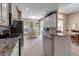 Open kitchen offers granite countertops, stainless steel appliances and has views of the breakfast nook and dining room at 5548 Simonton St, Bradenton, FL 34203