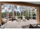 Outdoor lanai with tile flooring and chairs, perfect for relaxing and entertaining at 5548 Simonton St, Bradenton, FL 34203
