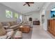 Inviting living room with tile floors, comfortable seating, and a bright, airy feel at 5548 Simonton St, Bradenton, FL 34203