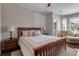 Inviting bedroom with a wood bed frame, matching nightstands and a comfortable sitting area at 5548 Simonton St, Bradenton, FL 34203