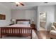 Inviting main bedroom with hardwood floors, a cozy rug, and an ensuite bathroom at 5548 Simonton St, Bradenton, FL 34203