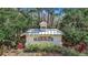 Welcoming entrance sign 'Harborage' surrounded by lush greenery at 5548 Simonton St, Bradenton, FL 34203