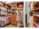 Organized walk-in closet with custom shelving and ample storage for clothing and accessories at 5548 Simonton St, Bradenton, FL 34203