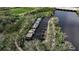 Aerial view of a waterfront property featuring a boat dock and natural surroundings at 5548 Simonton St, Bradenton, FL 34203
