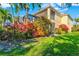 The backyard offers vibrant landscaping, a screened-in patio, and a well-maintained lawn providing a private retreat at 5670 Rock Dove Dr, Sarasota, FL 34241