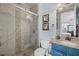 Modern bathroom featuring tiled shower with glass door, granite countertop, and designer fixtures at 5670 Rock Dove Dr, Sarasota, FL 34241