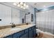 Updated bathroom with dual sinks, granite countertops, a shower, and a bathtub at 5670 Rock Dove Dr, Sarasota, FL 34241