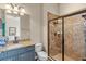 Bathroom features tiled shower with glass door, granite countertop, and modern fixtures at 5670 Rock Dove Dr, Sarasota, FL 34241