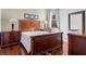 Well appointed bedroom featuring dark wood floors, matching dressers and a picture window at 5670 Rock Dove Dr, Sarasota, FL 34241