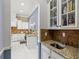 A close-up view of the kitchen, featuring a granite counter and white cabinetry at 5670 Rock Dove Dr, Sarasota, FL 34241