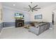Elegant living room featuring a cozy fireplace, modern ceiling fan, and stylish decor at 5670 Rock Dove Dr, Sarasota, FL 34241
