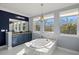 This main bathroom features a tub with decorative tile surround, vanity, mirrors, decor, and natural light at 5670 Rock Dove Dr, Sarasota, FL 34241