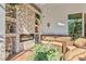 The screened-in patio features a cozy seating area with a fireplace, perfect for relaxation and entertainment at 5670 Rock Dove Dr, Sarasota, FL 34241